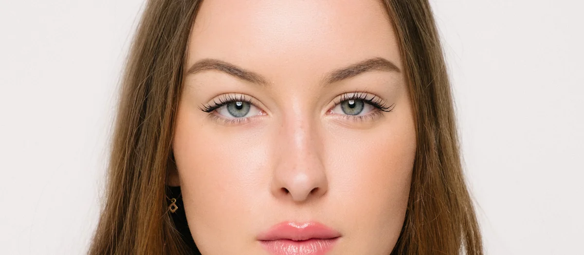 Retouched natural beauty portrait on a light background
