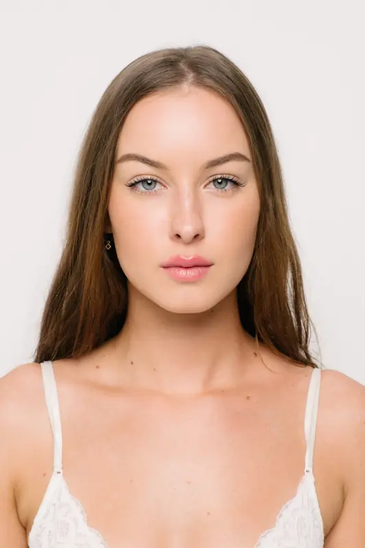 Retouched natural beauty portrait on a light background