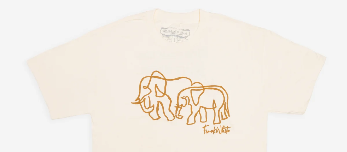 Cream graphic tee with an elephant print shot as a product flat for an online store